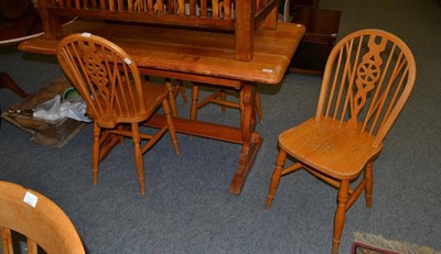 Lot 1090 - A pine refectory table and four pine chairs