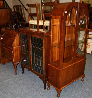 Lot 1099 - A 1920's mahogany vitrine cabinet, together with an oak leaf glazed bookcase of similar date...