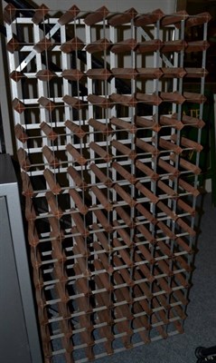 Lot 1106 - A metal framed and timber 105 bottle wine rack