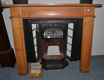 Lot 1109 - A Victorian fireplace with pine surround and tiled insert