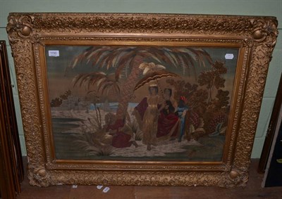 Lot 1150 - A large 19th century silk work picture, embroidered with 'The Finding of Moses', in a...