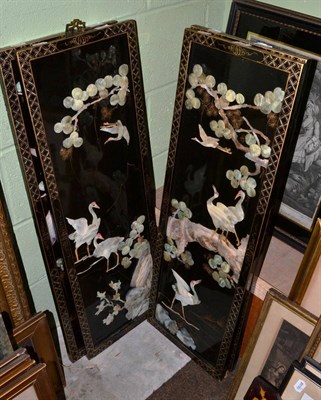 Lot 1173 - A set of four Japanese mother of pearl mounted lacquer panels