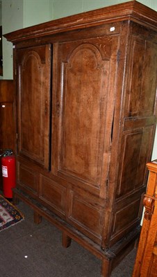 Lot 1183 - An 18th century panelled country linen press