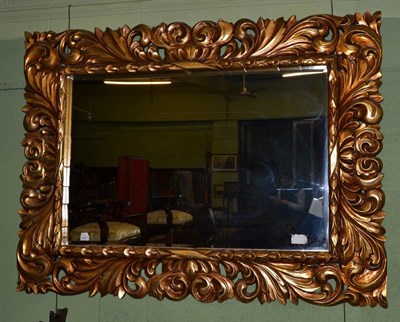 Lot 1187 - A gilt composition mirror