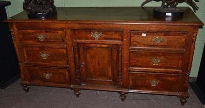 Lot 1188 - A Georgian oak sideboard