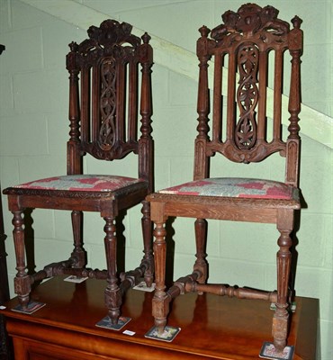 Lot 1191 - A pair of Period style carved hall chairs