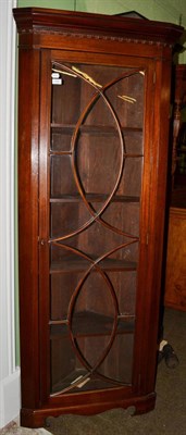 Lot 1197 - A George III mahogany standing corner cabinet