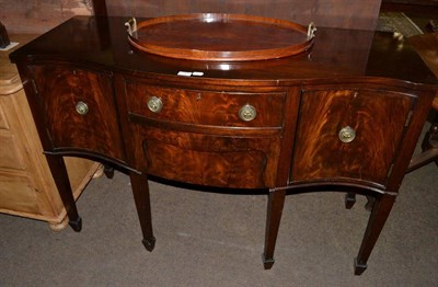 Lot 1199 - A mahogany serpentine sideboard together with an Edwardian oval twin handled tray (2)