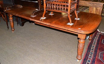 Lot 1208 - A wind out table, with two leaves