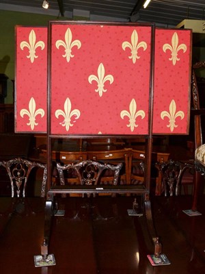 Lot 1219 - A mahogany firescreen on splayed legs