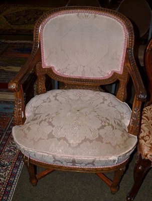 Lot 1231 - A 19th century carved mahogany open armchair with upholstered back and seat