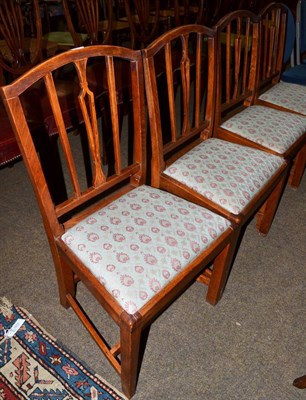 Lot 1233 - A set of four 20th century oak dining chairs