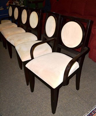 Lot 1239 - A set of six chairs of recent date, upholstered in beige velvet with padded back support and...