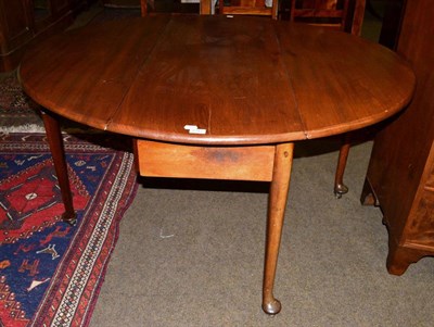 Lot 1243 - A mahogany gateleg dining table