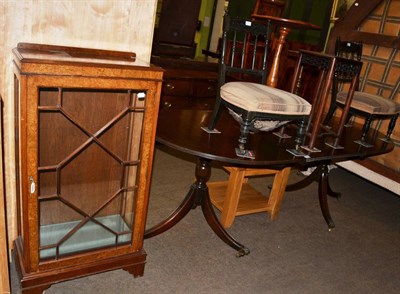 Lot 1258 - A group of furniture comprising a twin pedestal dining table, a glazed walnut display cabinet,...