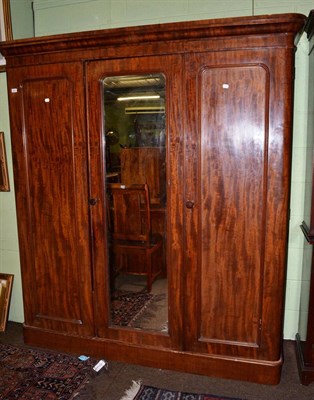 Lot 1264 - A Victorian mahogany three panel wardrobe