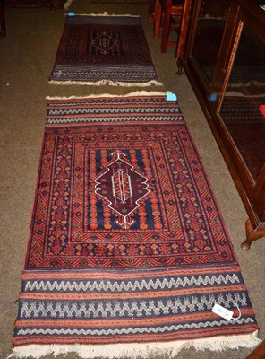 Lot 1280 - A Balouch rug, West Afghanistan, the field centred by a shaped panel enclosed by geometric stylised