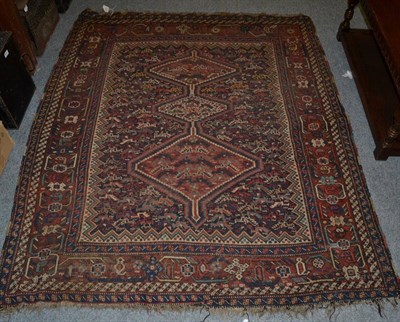 Lot 1287 - Khamseh rug, circa 1900, the indigo field of stylised chickens around three stepped medallions...