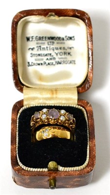 Lot 5 - A diamond set cluster ring stamped '18ct' and a 9 carat gold amethyst and seed pearl ring (2)
