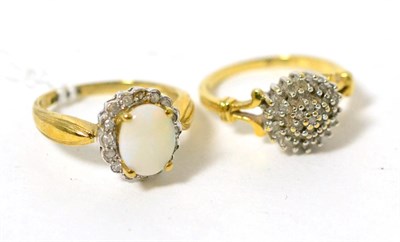 Lot 17 - An 18 carat gold diamond cluster ring and a 9 carat gold opal cluster ring (2)