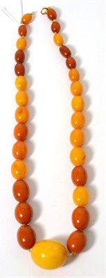 Lot 19 - An amber bead necklace, graduated oval amber beads knotted to a bolt ring clasp, length 53.5cm,...