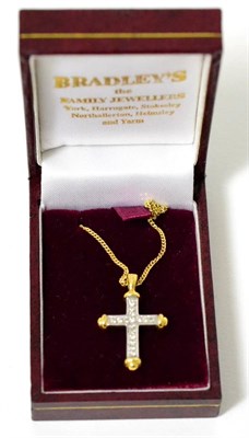 Lot 29 - An 18 carat gold diamond cross pendant on chain