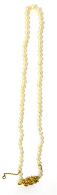 Lot 39 - A cultured pearl necklace, a single strand of graduated cultured pearls, knotted to a barrel shaped