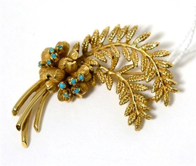 Lot 40 - A turquoise set floral spray brooch, measures 5.5cm by 4cm, stamped '14K'