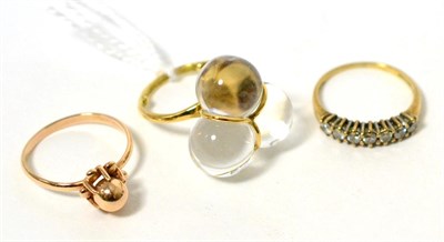 Lot 47 - A rock crystal ring, stamped '750', a Russian beaded ring, stamped '583' and a 9 carat gold diamond