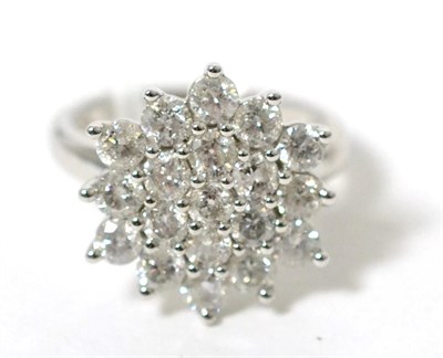 Lot 72 - A 9 carat white gold diamond cluster ring, total diamond weight 2.50 carat, finger size N1/2