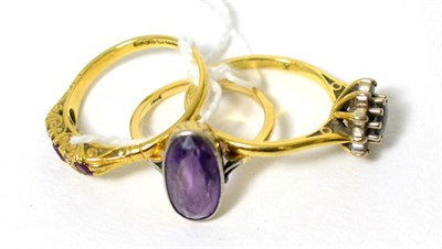 Lot 88 - An 18 carat gold ruby and diamond ring, an 18 carat gold sapphire cluster ring and an amethyst...