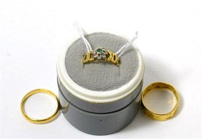 Lot 94 - Two 22 carat band rings and an 18 carat gold dress ring (3)