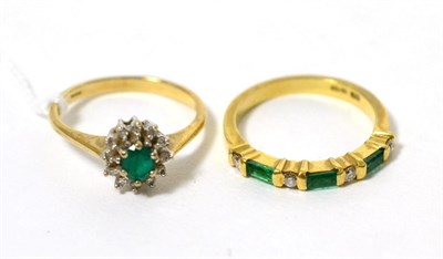 Lot 97 - An 18 carat gold emerald and diamond half hoop ring and a 9 carat gold emerald cluster ring (2)