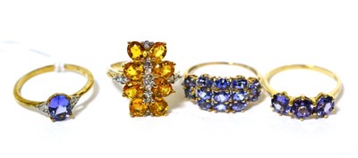 Lot 112 - Three 9 carat gold tanzanite rings, finger size S and a 9 carat gold yellow sapphire cluster...