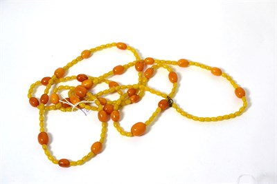 Lot 124 - An amber and yellow plastic bead necklace