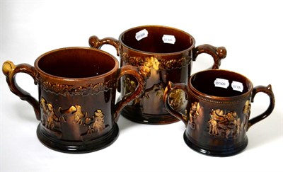 Lot 144 - Three ";Rockingham"; treacle glazed frog mugs