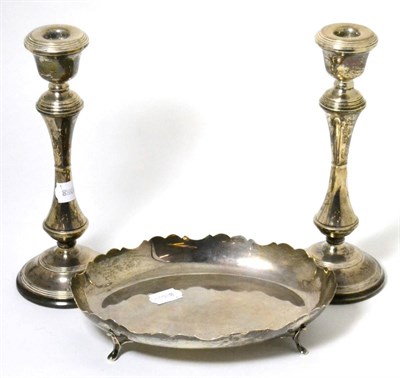 Lot 154 - A pair of Georgian style silver candlesticks, Birmingham, 1969; with a silver dish, E. Viner,...