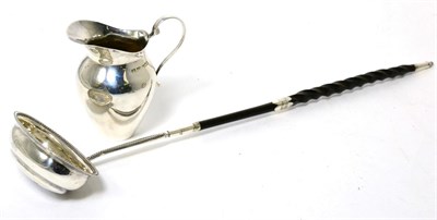 Lot 186 - A George III silver toddy ladle, makers mark TS, circa 1800; together with a small silver cream jug