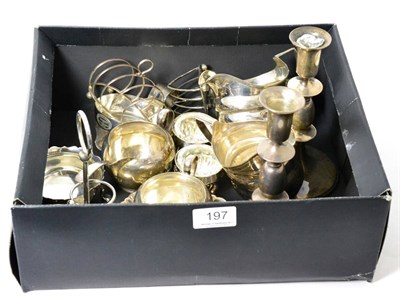 Lot 197 - A group of silver items including: two toast racks; a cruet stand (lacking bottles); a pair of...