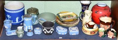 Lot 216 - A shelf of Wedgwood, Jasperware, Royal Doulton plates and character jugs and two Carlton ware vases