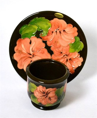 Lot 235 - Walter Moorcroft coral Hibiscus planter and plate, on a brown ground (2)