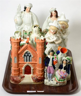 Lot 283 - A group of Staffordshire flat back castles and figures