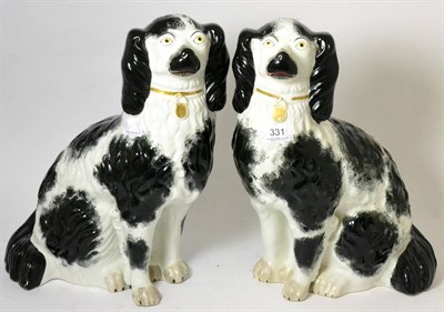 Lot 331 - A pair of large 19th century Staffordshire black and white spaniels