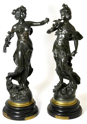 Lot 335 - A pair of French spelter figures, ladies holding flowers, one (a.f.)