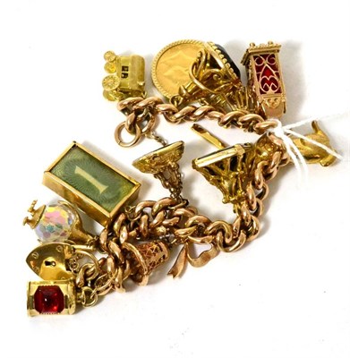 Lot 377 - A 9ct gold charm bracelet, set with thirteen charms including a 1907 half sovereign and three...