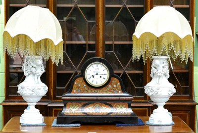 Lot 378 - A pair of decorative white glazed table lamps decorated with putti