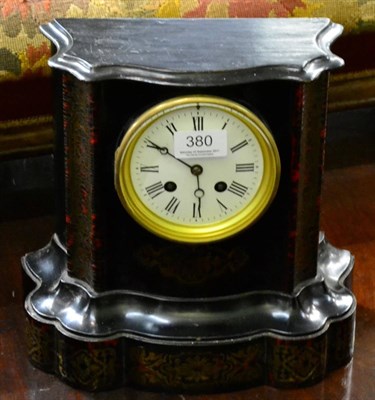 Lot 380 - An ebonised and brass striking mantel clock