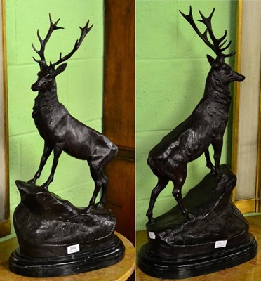 Lot 384 - A pair of reproduction bronzed figures of stags