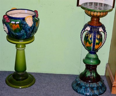 Lot 388 - A Majolica style jardiniere and stand, mask detail; with another stand (3)