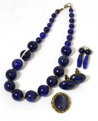 Lot 399 - A lapis lazuli graduated bead necklace, a pair of lapis lazuli earrings, a brooch and a pair of...